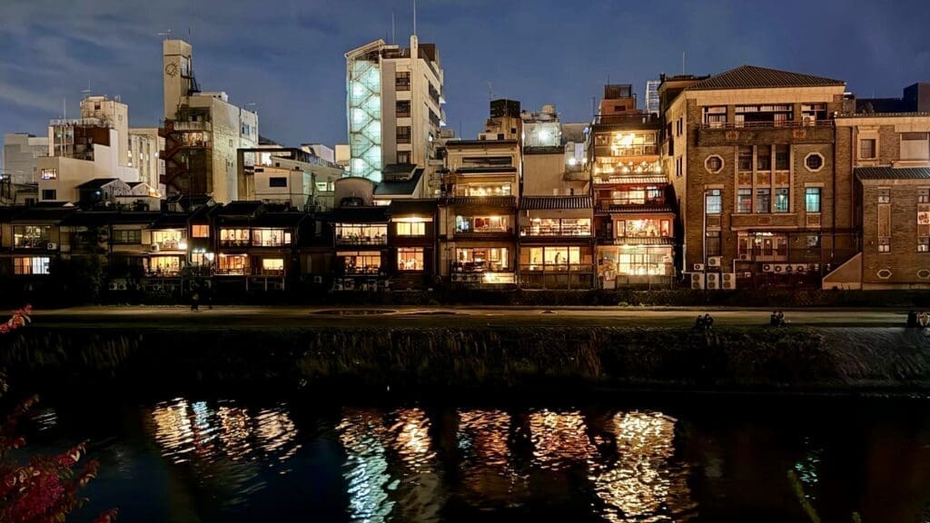 Night view of traditional buildings and restaurants along the Kamogawa River in Kyoto, Japan